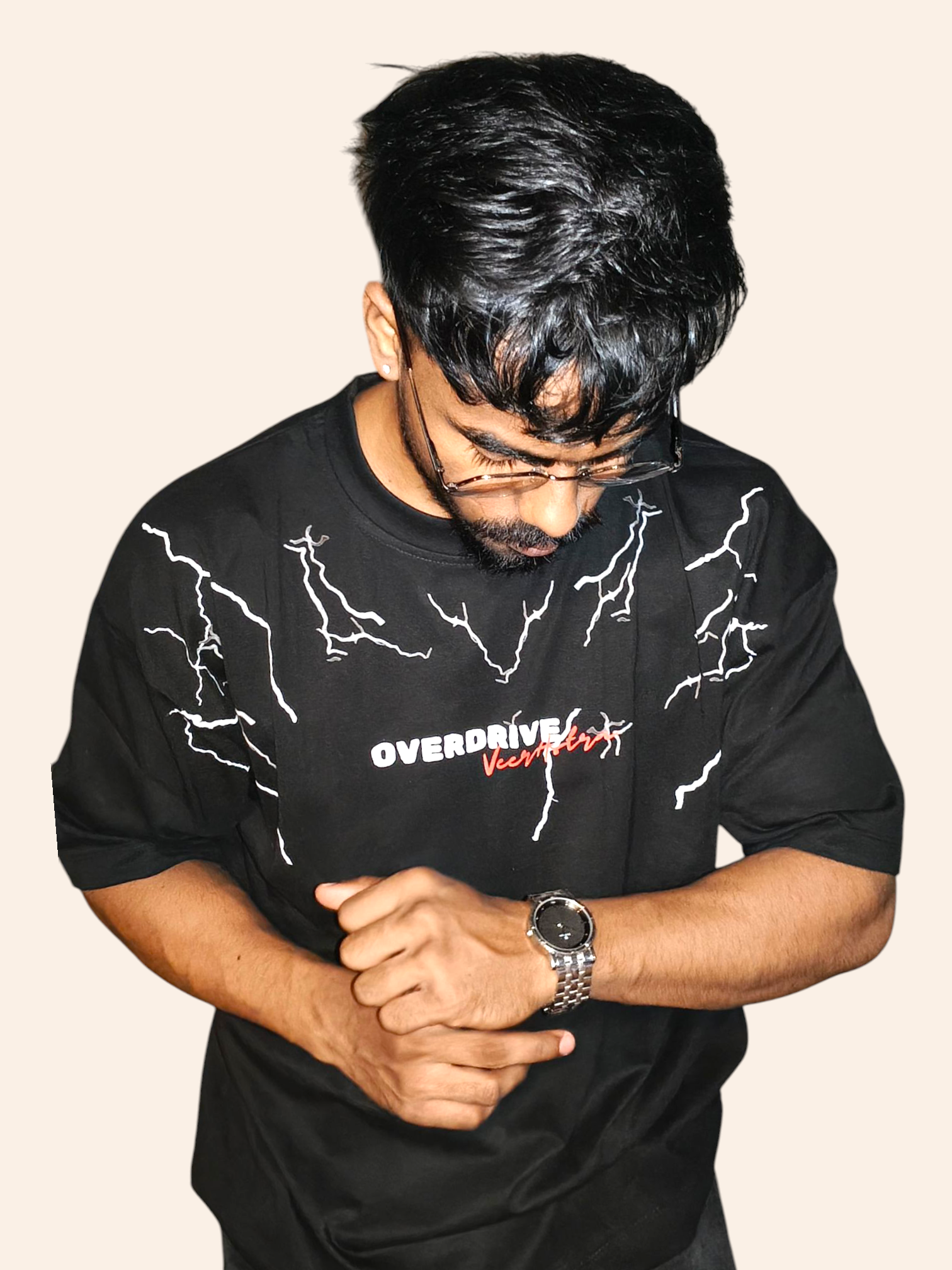 Person wearing a VeerAstra black t-shirt with white graphics and text on a beige background