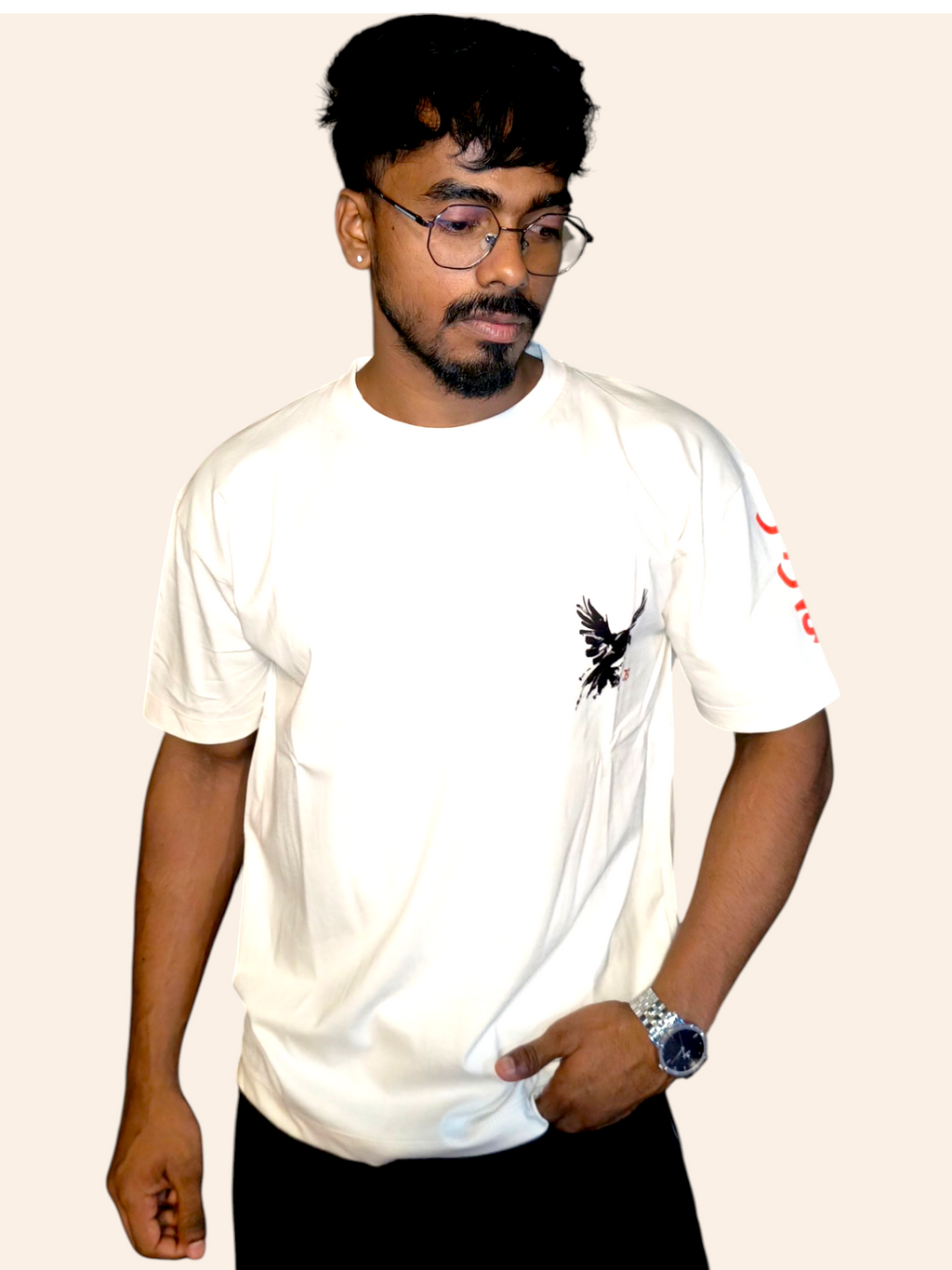 Person wearing a VeerAstra off-white t-shirt with a black design on a plain background