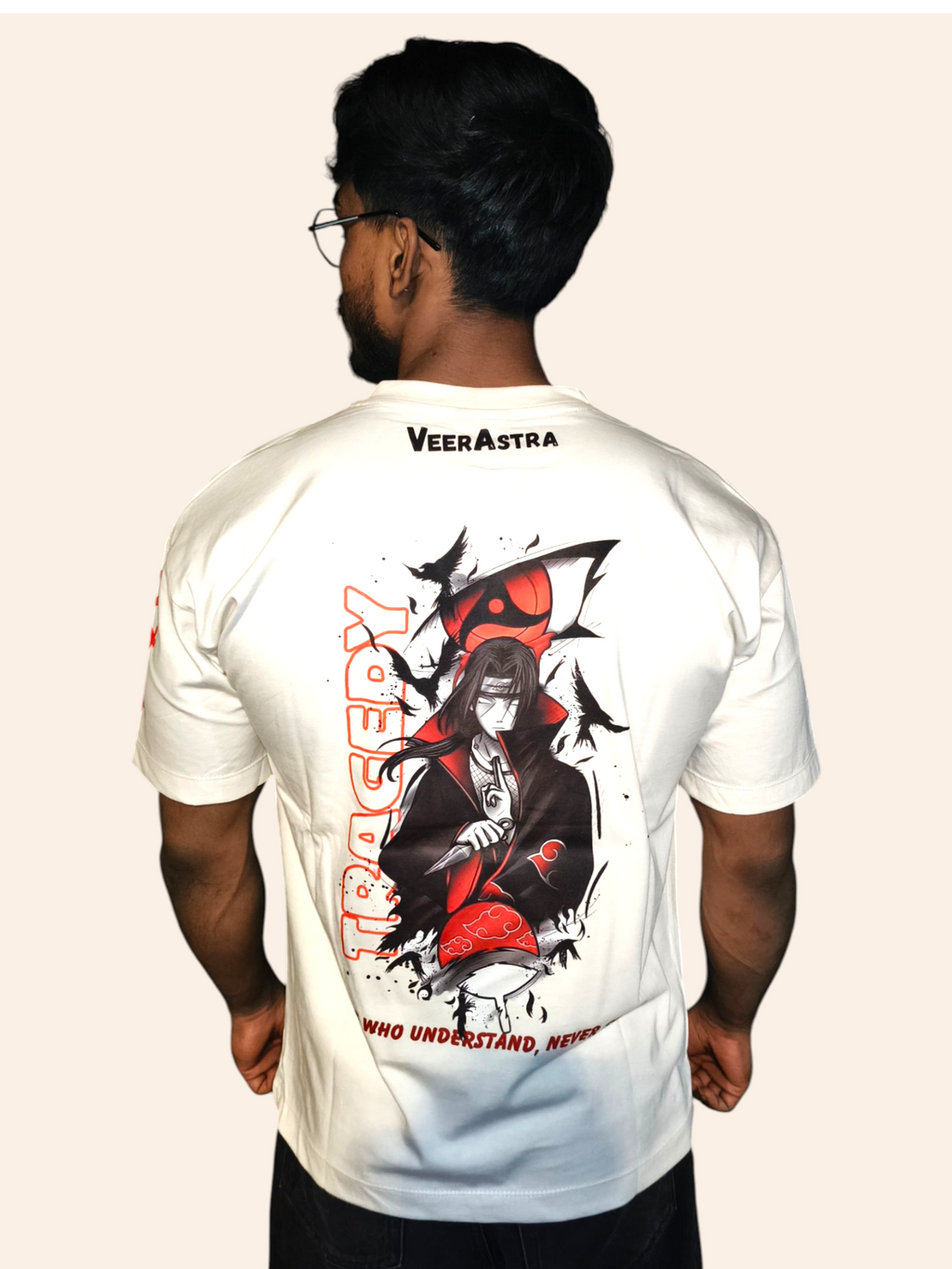 Person wearing a VeerAstra off-white t-shirt with a graphic design and text on the back, on a plain background.