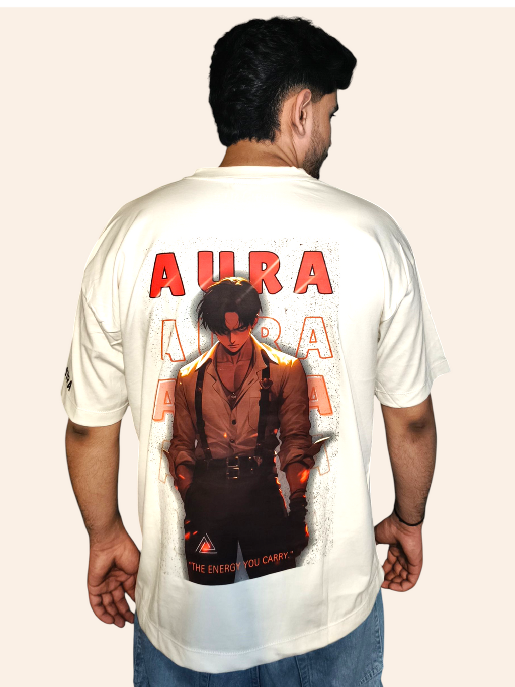 Person wearing a white VeerAstra t-shirt with 'Aura' design and text on the back.