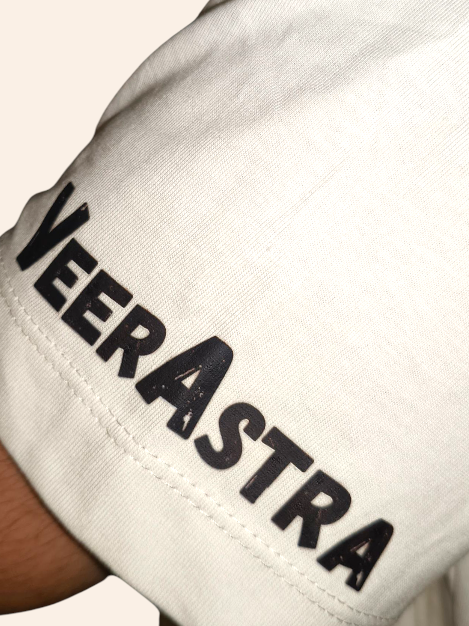 White sleeve with 'VEERASTRA' text on a white background