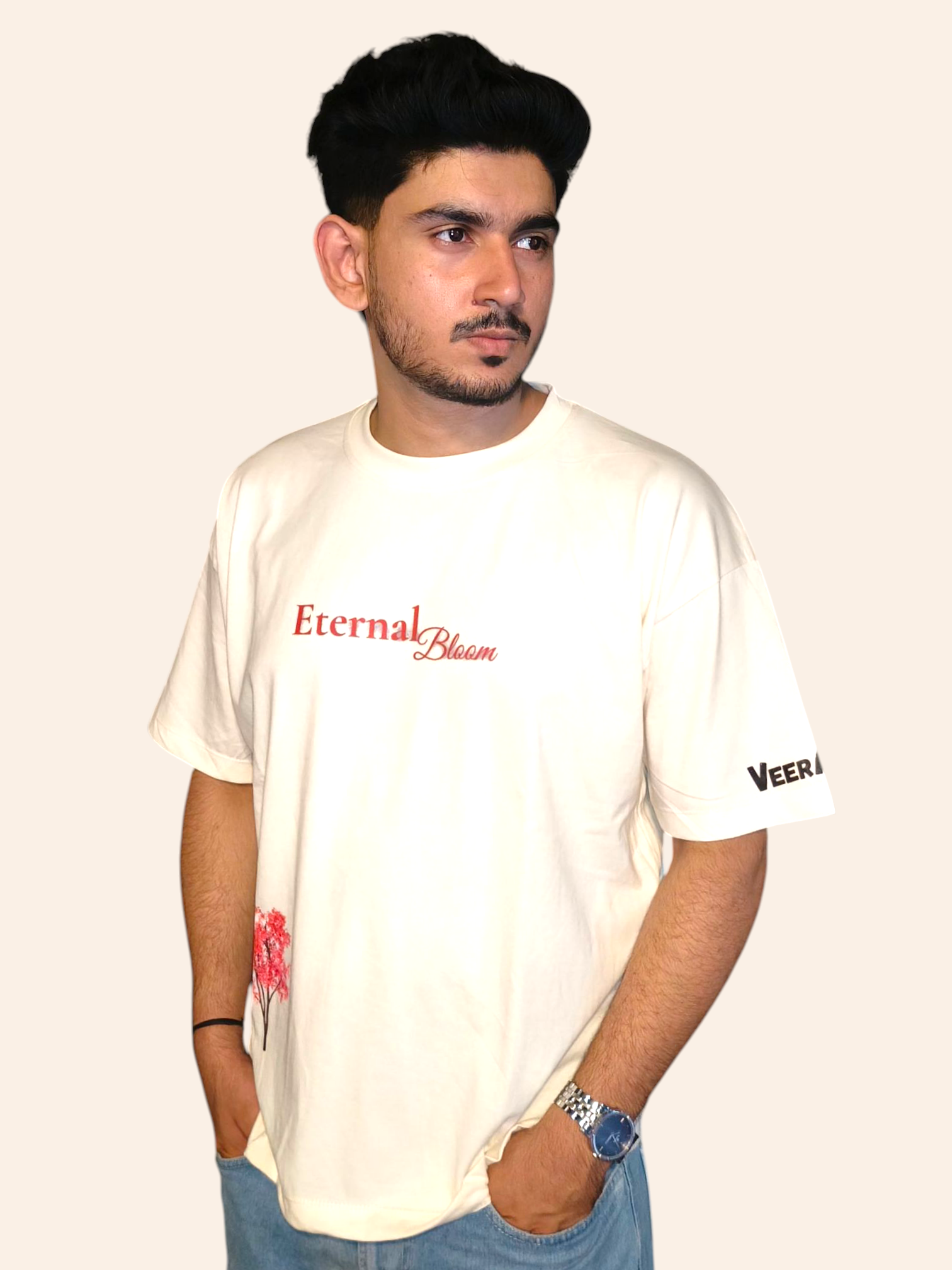 Man wearing a white t-shirt with 'Eternal Bloom' text and 'VeerAstra' branding on a plain background