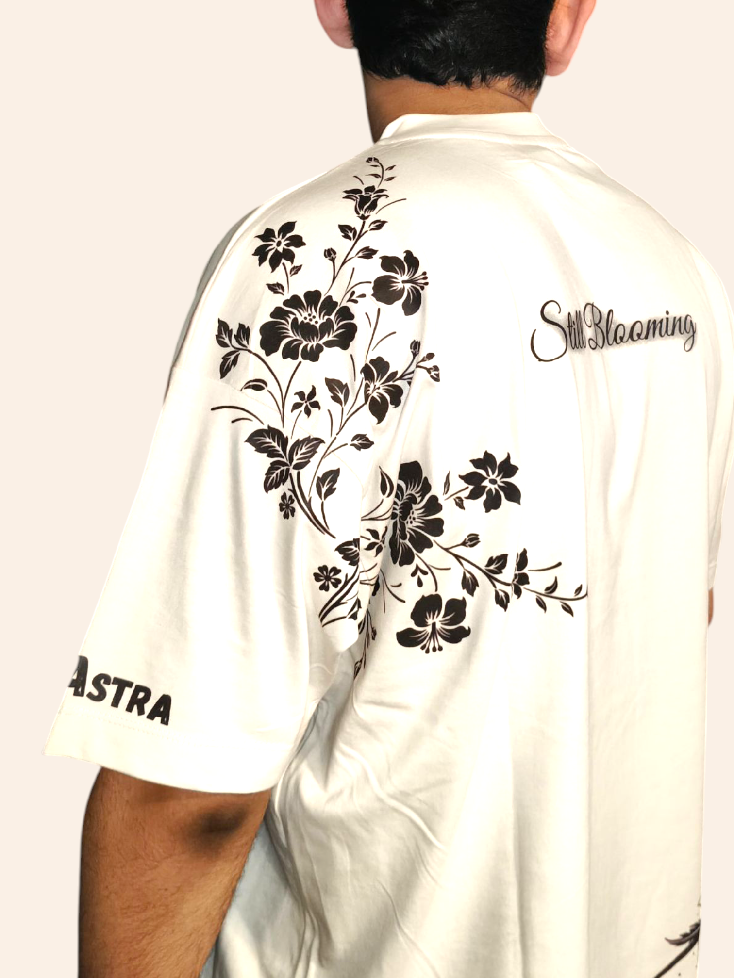VeerAstra White shirt with black floral designs and branding on a plain background