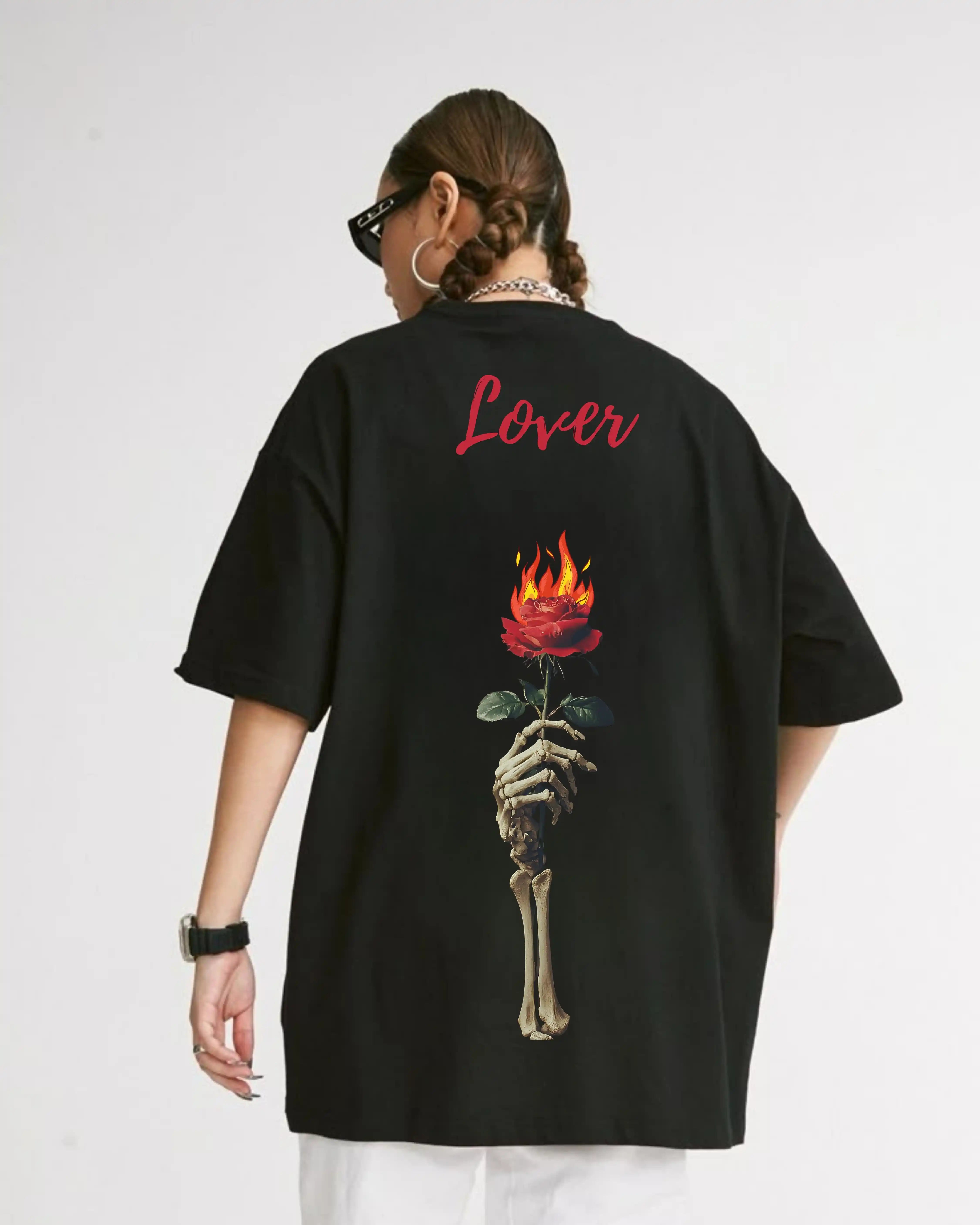 Person wearing a VeerAstra Lover Oversized black t-shirt with a skeleton hand holding a flaming rose and the word 'Lover' on the back.
